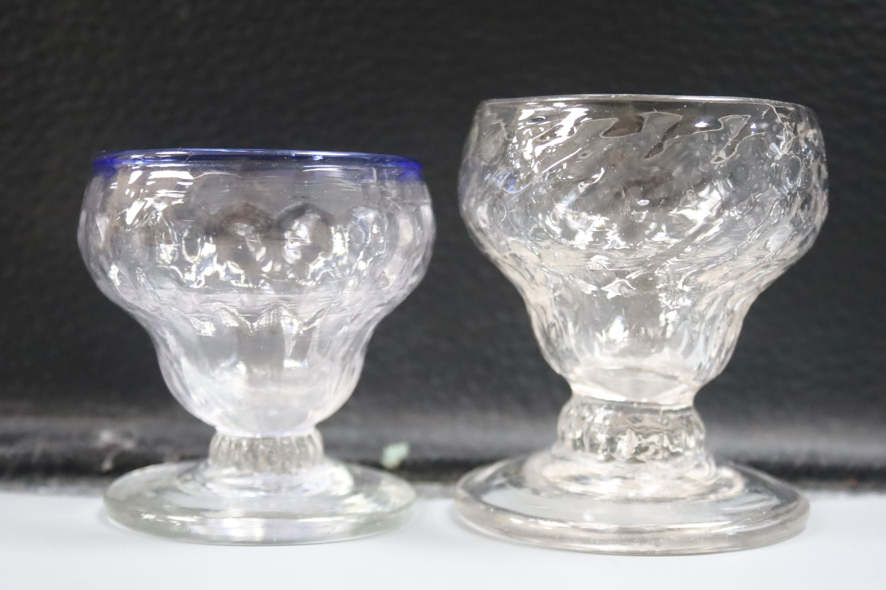 Four 18th century sweetmeat glasses, two with applied blue cable, a George III rummer and an 1842 commemorative goblet